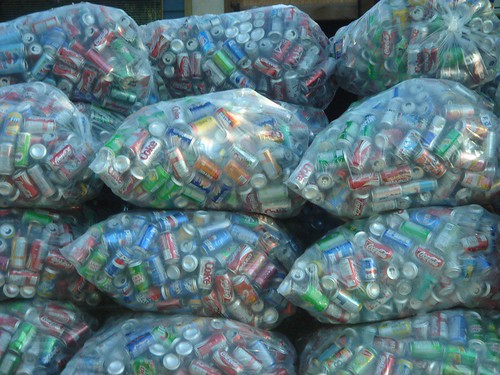 plastic bags filled with soda cans